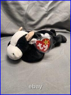 Rare, Retired, and 1st year Beanie Babies Daisy The Cow. Tag Error