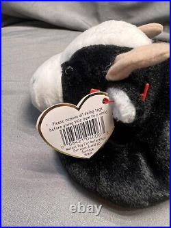 Rare, Retired, and 1st year Beanie Babies Daisy The Cow. Tag Error